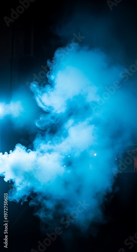 Vibrant blue smoke on black background.