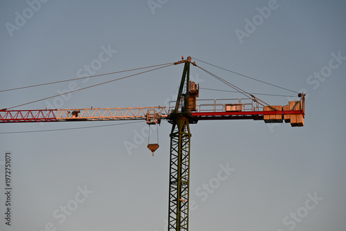 fishing boats in port, construction site with crane