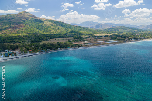 Scenic Panorama Aerial Drone Picture of the crystal clear water and the beach and Mount Katung-uhan in Botolan, Zambales in the Philippines 