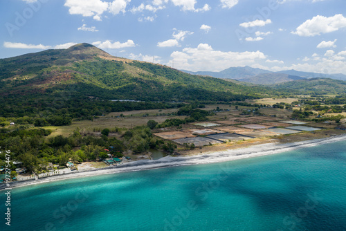 Scenic Panorama Aerial Drone Picture of the crystal clear water and the beach and Mount Katung-uhan in Botolan, Zambales in the Philippines 