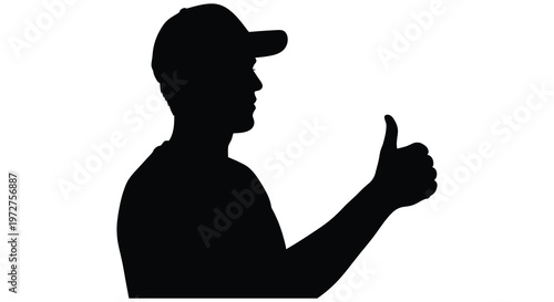 A dark silhouette of a man wearing a cap giving a thumbs up gesture representing positivity and approval silhouette high quality professional