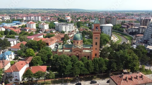 Drone glides toward the Church of Holy Trinity, an iconic landmark of town Paracin in Serbia.