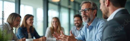 Business people talk in meeting room. Diverse team discuss project strategy at table. Colleagues share ideas plan future work for corporate development.