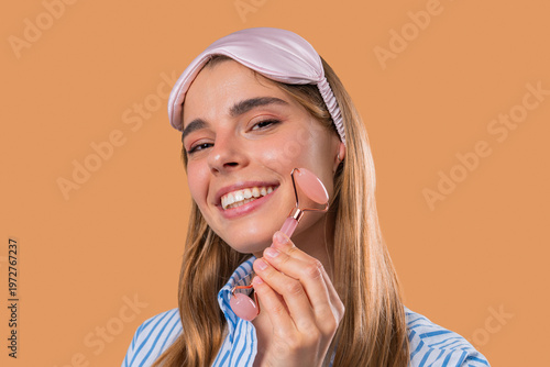 Photos Charming Woman Doing Face Massage With Rose Quartz Stone Roller For Firmer Skin