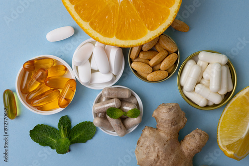 Natural supplements of various types and natural ingredients to maintain health on a bright background
