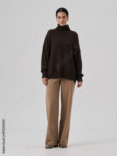 Fashion shooting in studio . Professional model , fashionable clothes and style, new collection. stylish look	