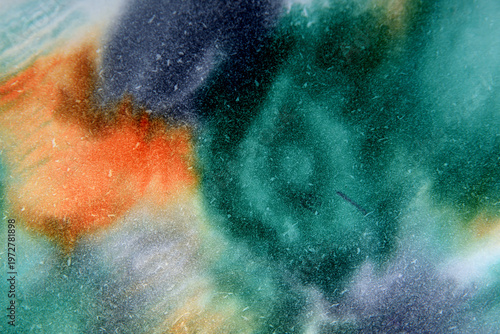 art background from green orange divorces in a cold tone