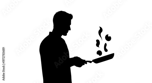 Silhouette of a professional male chef tossing food in a frying pan during meal preparation