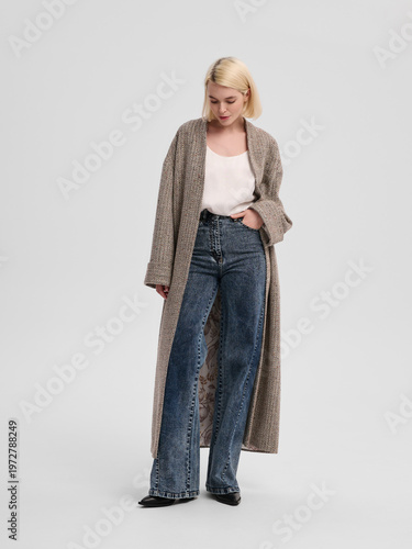 Fashion shooting in studio . Professional model , fashionable clothes and style, new collection. stylish look	