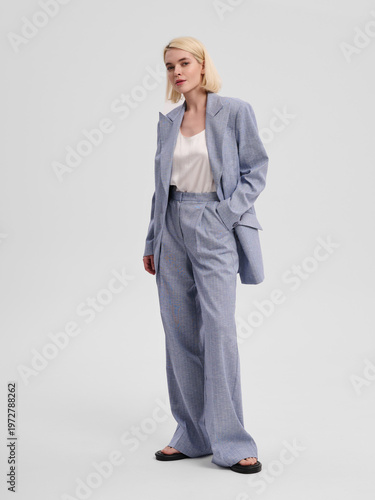 Fashion shooting in studio . Professional model , fashionable clothes and style, new collection. stylish look	