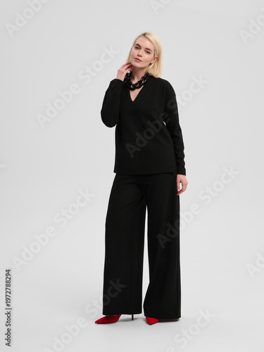 Fashion shooting in studio . Professional model , fashionable clothes and style, new collection. stylish look	