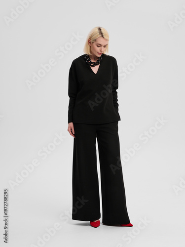 Fashion shooting in studio . Professional model , fashionable clothes and style, new collection. stylish look	