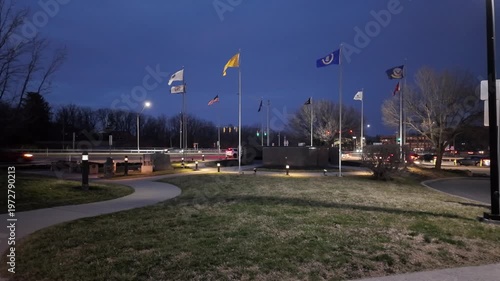 West Virginia Rest Stop With Flags and Traffic During Nighttime