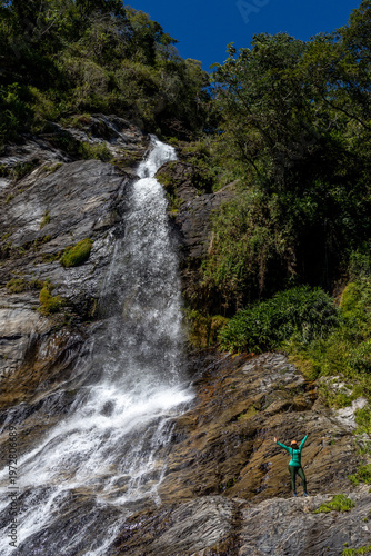 Obraz na płótnie Latina mountaineers in front of a waterfall in the eastern part of Waraira Repano National Park in Guatire