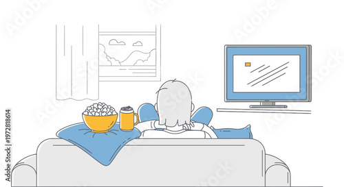 Woman sitting on couch watching TV.