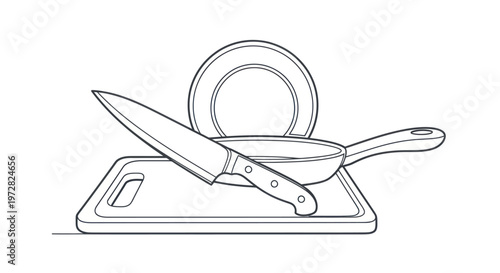 Knife on cutting board with pan.