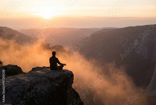 Meditation on a mountain peak at sunrise