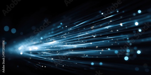 Abstract Blue Light Streaks and Bokeh Particles on Dark Background.