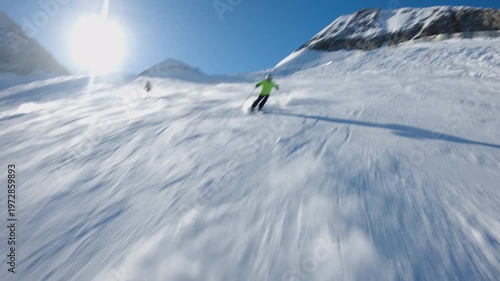 Skier in fast descent down a snowy slope, dynamic winter scene, high speed