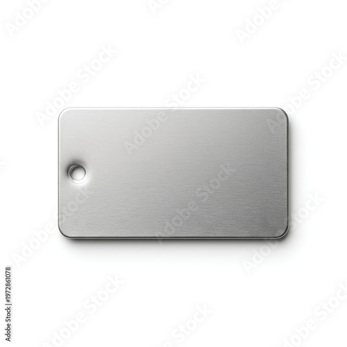 Blank metal tag with a hole for attaching to items or objects.