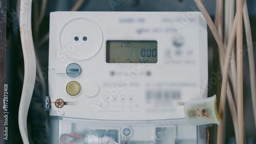 Close-up of Modern Digital Electricity Meter with Active LCD Display | Electronic Power Counter Showing Energy Consumption Data | Household Smart Utility Monitoring Concept