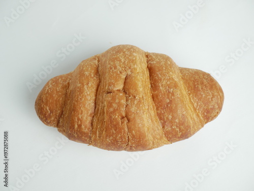 Photography Freshly baked golden croissant on white background