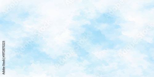 A beautiful clear blue sky with fluffy white clouds creates a bright natural cloudscape on a sunny summer day