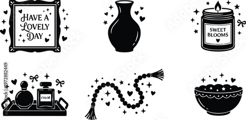 Black and white lovely day framed quote with vase candle perfume beads and bowl icons