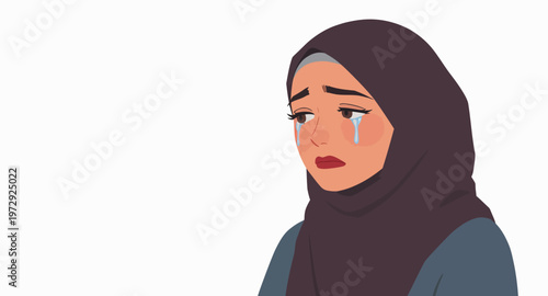 Sad woman wearing a hijab crying.
