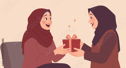 Two women in hijabs exchanging a gift.