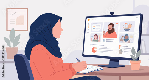 woman in hijab working on computer.