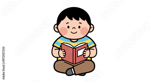 A cute little boy sitting cross-legged reading a book indoors happily