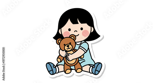 A cute little girl sitting and hugging a brown teddy bear toy