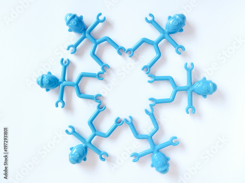 Blue Plastic Toy Figures Arranged in a Circle for Teamwork and Unity Concept