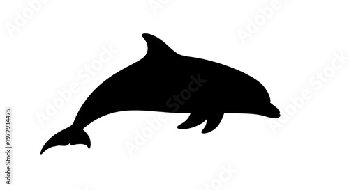 Black silhouette of a dolphin swimming.