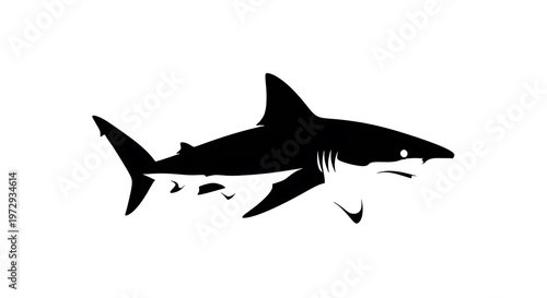 Black silhouette of a shark swimming.