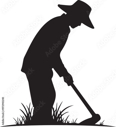 Black silhouette of man digging with shovel in grass
