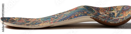 Close-up side view of a colorful, patterned orthopedic insole on a white background.