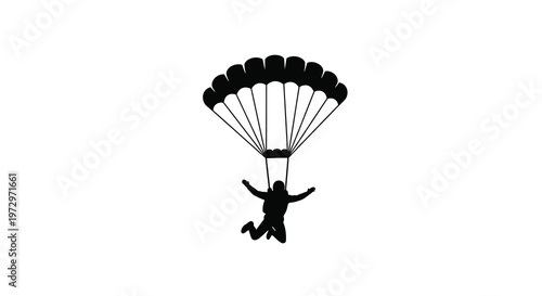 Silhouette of a parachutist descending with an open canopy