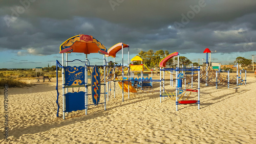 Jurien Western Australia an empty colorful playground on sandy shore under dramatic sky