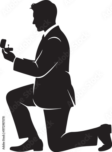 Man in suit kneeling holding ring box proposal