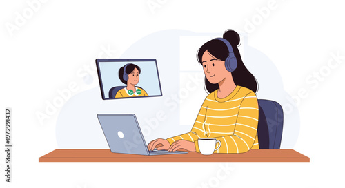 Young woman wearing headphones and sitting at a desk while having a video call with a friend on her laptop at home.