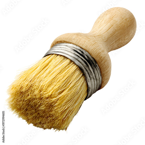 Close up studio shot of a small round paint brush with wooden handle and bristles