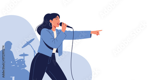 Passionate female singer in a blue jacket performing with a microphone on stage as a drummer plays in the blurred background.