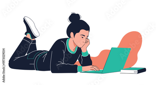 Dedicated student lies on the floor while focused on studying from a laptop and a book, showing a casual and comfortable learning style.