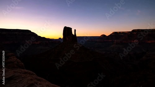 Sunrise over the majestic Monument Valley with iconic buttes and mesas bathed in golden light.
