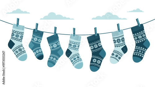 Seven blue and white patterned winter socks hanging on a clothesline under clouds, creating a festive and cozy winter scene.