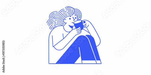 Woman enjoying a warm drink while sitting with her knees drawn up