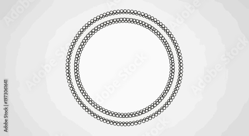 Two concentric circular chains made of small black circles on a textured light grey background