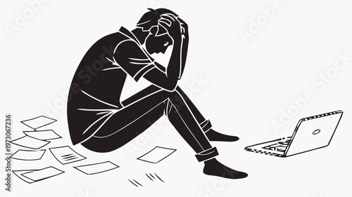 Frustrated person sitting with laptop and scattered papers feeling overwhelmed and stressed